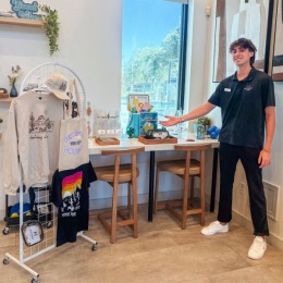 a person standing in front of some merchandise